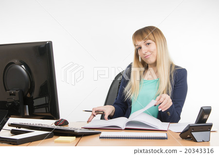 Arrogant office a specialist office leafing through a book and looking at the frame Arrogant office a specialist office leafing through a book and looking at the frame 20343316