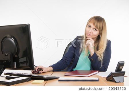 Upset by a specialist working in the office computer, look into the frame Upset by a specialist working in the office computer, look into the frame 20343320