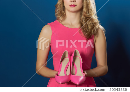 Woman holging high hill pink new shoes Woman holging high hill pink new shoes 20343886