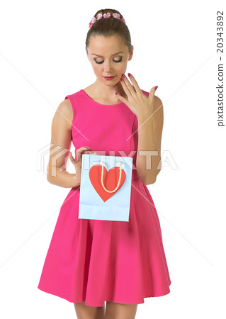 Portrait of beautiful lady looking heart gift box Portrait of beautiful lady looking heart gift box 20343892