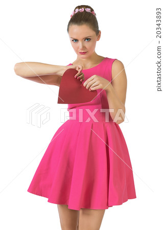 Young pretty woman in pink dress breaking heart Young pretty woman in pink dress breaking heart 20343893