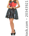 Young woman holding red hearts, long legs isolated 20343921
