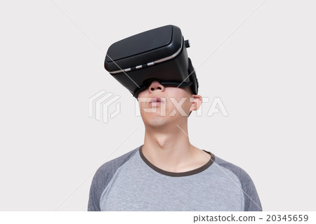 Asian man wearing VR goggle Asian man wearing VR goggle 20345659