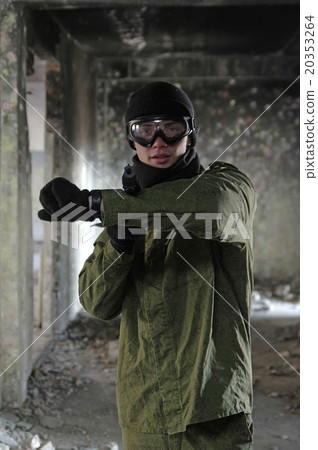 portrait of young soldier pointing with gun 20353264