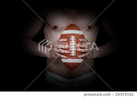 Composite image of shirtless american football player holding a Composite image of shirtless american football player holding a 20354592