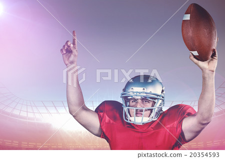 Composite image of american football player with arms raised hol Composite image of american football player with arms raised hol 20354593