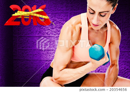 Composite image of strong woman doing bicep curl with blue dumbb 20354656