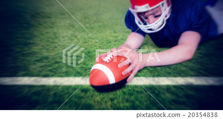 Composite image of american football player scoring a touchdown Composite image of american football player scoring a touchdown 20354838