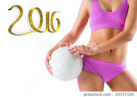 Composite image of fit girl in pink bikini holding ball Composite image of fit girl in pink bikini holding ball 20355184