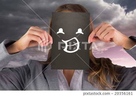 Composite image of businesswoman showing card 20356161