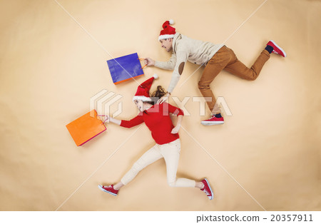 Christmas couple with shopping bags 20357911
