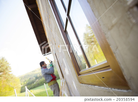 Man insulating windows Man insulating windows 20358594