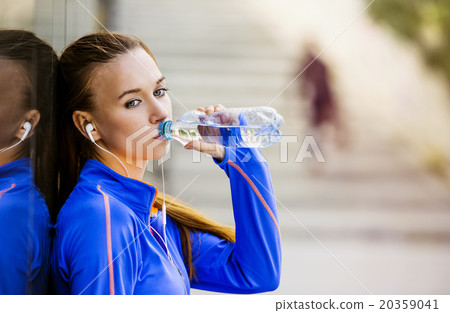 Female runner having break Female runner having break 20359041
