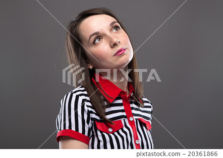Young brunette woman looking up Young brunette woman looking up 20361866