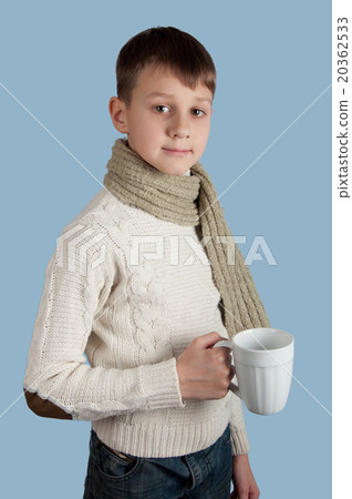 Cute boy with a cup on blue background 20362533