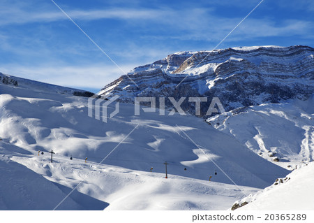 Ski resort and sunlight rocks at evening 20365289
