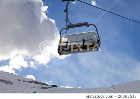 Chair-lift in ski resort at sun evening Chair-lift in ski resort at sun evening 20365635