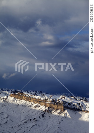 Sunlight winter mountains and storm clouds 20365638