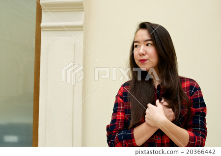 Girl holding hands on the chest 20366442