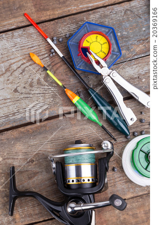 fishing tackles for anglers on wooden background fishing tackles for anglers on wooden background 20369166