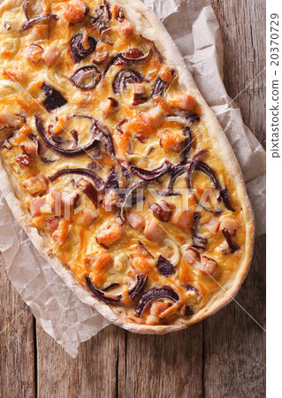 flammkuchen close-up on a paper. vertical top view 20370729