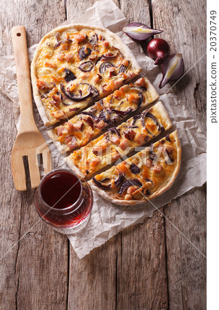 sliced Tarte flambee and red wine top view 20370749