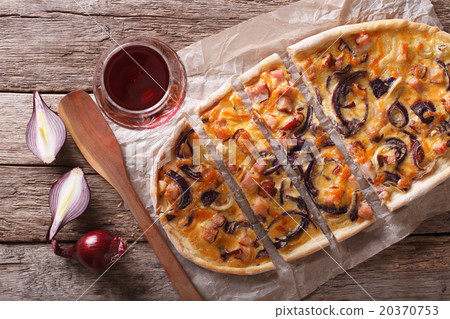 sliced Tarte flambee and red wine close-up. sliced Tarte flambee and red wine close-up. 20370753