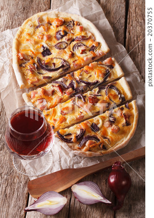 Tarte flambee sliced and red wine close-up 20370755