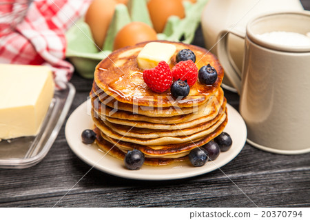 High pile of delicious pancakes High pile of delicious pancakes 20370794