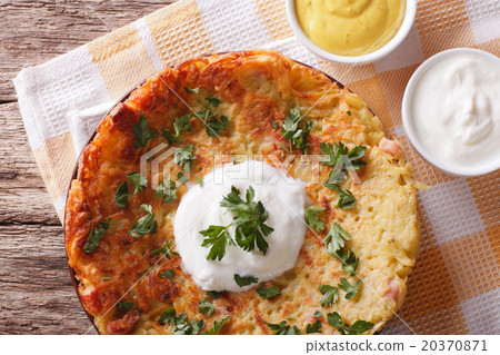 Potato pancakes with sauce close-up on a plate 20370871