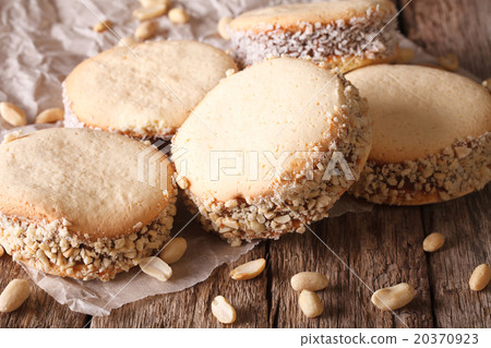 cookies alfajores with cream on paper close-up 20370923