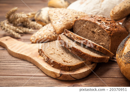Bread assortment on wooden surface 20370951
