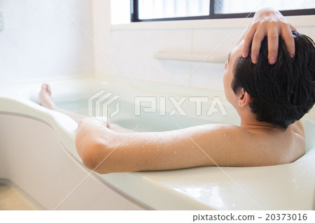 A young man taking a bath 20373016