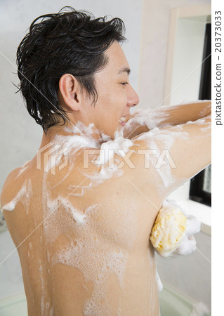 A young man washing his body 20373033