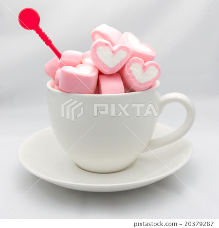 Marshmallow hearts in cup on white Marshmallow hearts in cup on white 20379287