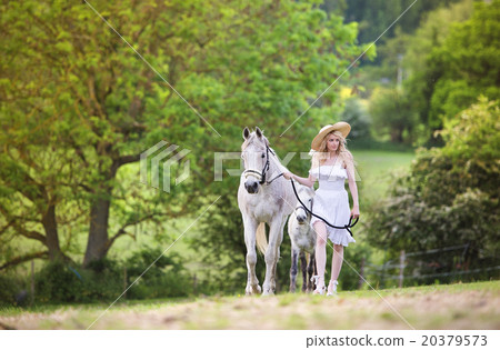 Woman with horse 20379573
