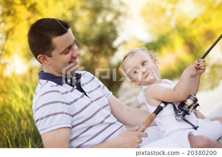 Happy father and daughter fishing 20380200