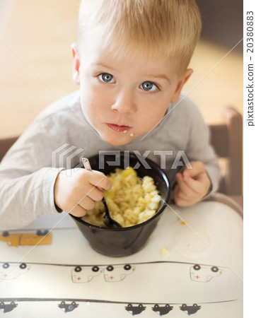 Little boy eating Little boy eating 20380883