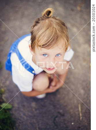 Sad little girl on the road 20381024