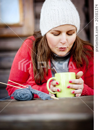 Winter girl knitting 20381374