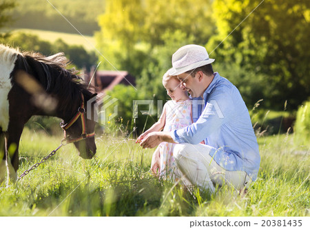 Father with daughter in nature 20381435