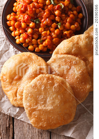 Indian puri and chana masala close-up on the table 20390366