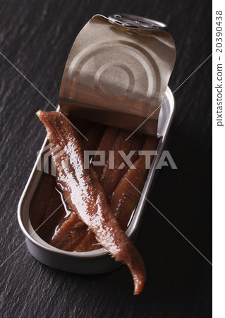Canned anchovy fillets closeup on a slate board Canned anchovy fillets closeup on a slate board 20390438