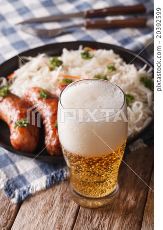 Lager beer and sauerkraut with sausage close-up 20392599