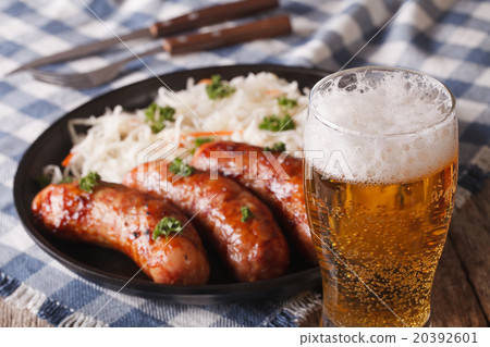 Lager beer and snacks of sausages and sauerkraut Lager beer and snacks of sausages and sauerkraut 20392601