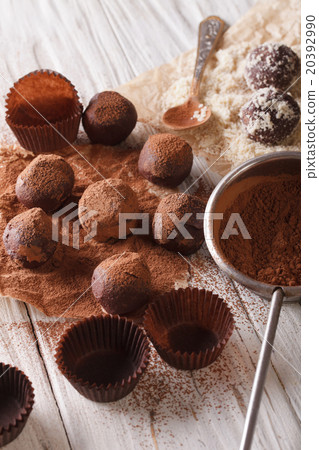 sprinkling chocolate truffles cocoa powder and nut 20392990