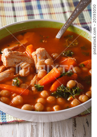 Delicious chickpea soup with chicken close-up Delicious chickpea soup with chicken close-up 20393050