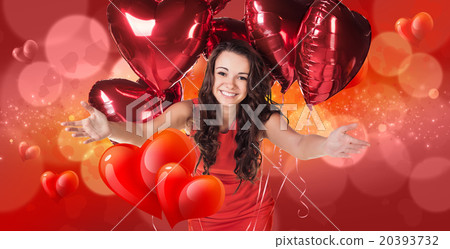 Woman in red dress stands on bokeh background Woman in red dress stands on bokeh background 20393732
