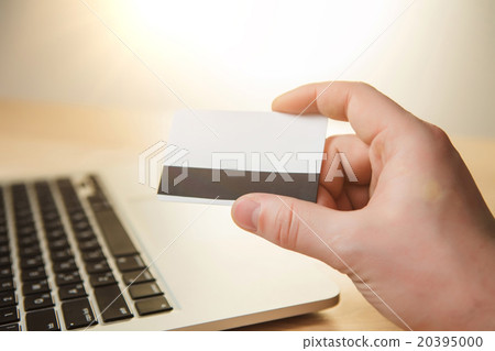 The man doing online shopping with credit card The man doing online shopping with credit card 20395000