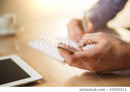 The male hand holding a phone The male hand holding a phone 20395011